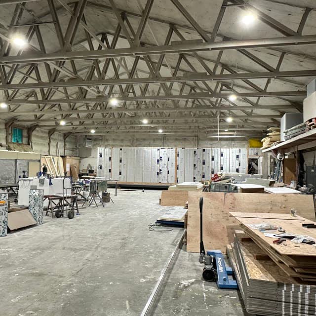 Production modules under construction in a workshop.